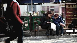 Girl reading a newspaper in Moldova